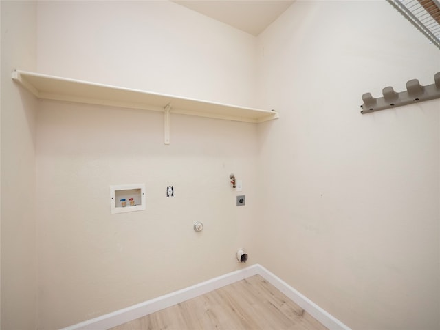 1010 Barclay Dr, Leander, TX 78641 - laundry room featuring baseboards, electric dryer hookup, hookup for a washing machine, light wood finished floors, and gas dryer hookup