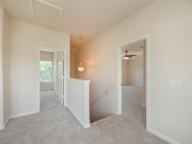 1010 Barclay Dr, Leander, TX 78641 - hall with an upstairs landing, carpet floors, and baseboards