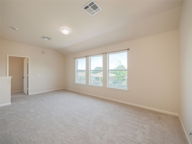1010 Barclay Dr, Leander, TX 78641 - spare room with light carpet, lofted ceiling, and baseboards