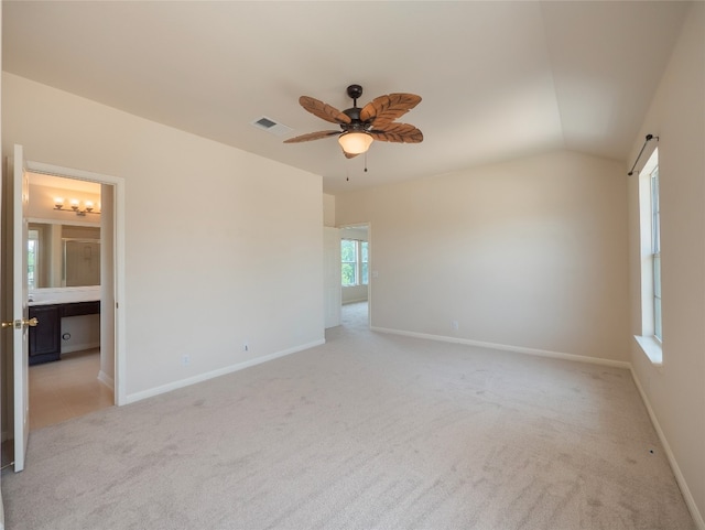 1010 Barclay Dr, Leander, TX 78641 - empty room with light carpet, a ceiling fan, baseboards, and vaulted ceiling