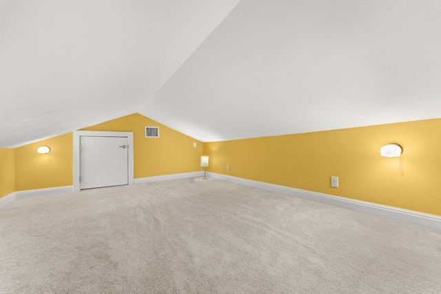 2004 Bremen St, Austin, TX 78703 - bonus room with lofted ceiling, carpet floors, and baseboards