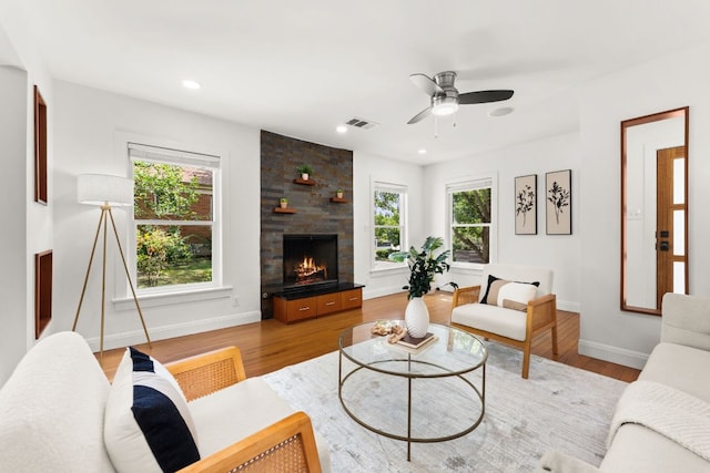 2004 Bremen St, Austin, TX 78703 - living room with a fireplace, ceiling fan, wood finished floors, and recessed lighting