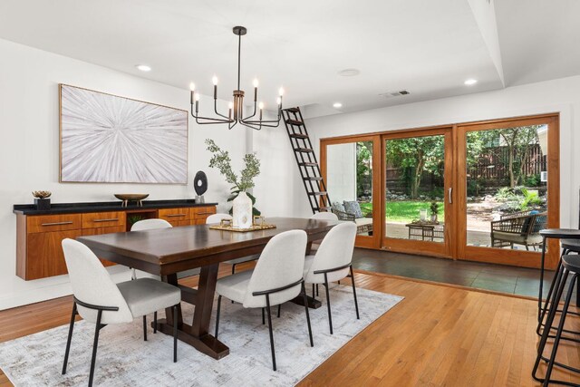 2004 Bremen St, Austin, TX 78703 - dining space with a chandelier, light wood finished floors, and recessed lighting