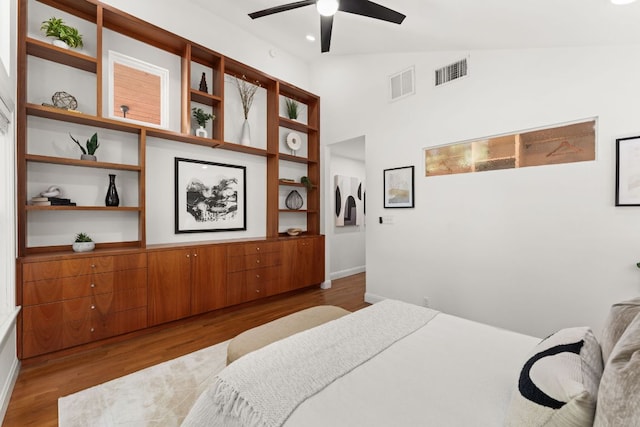 2004 Bremen St, Austin, TX 78703 - bedroom with wood finished floors, lofted ceiling, baseboards, and a ceiling fan