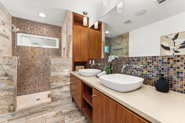 2004 Bremen St, Austin, TX 78703 - full bathroom featuring a shower stall, double vanity, tasteful backsplash, and recessed lighting