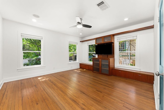 2004 Bremen St, Austin, TX 78703 - unfurnished living room with hardwood / wood-style flooring, a ceiling fan, baseboards, and recessed lighting