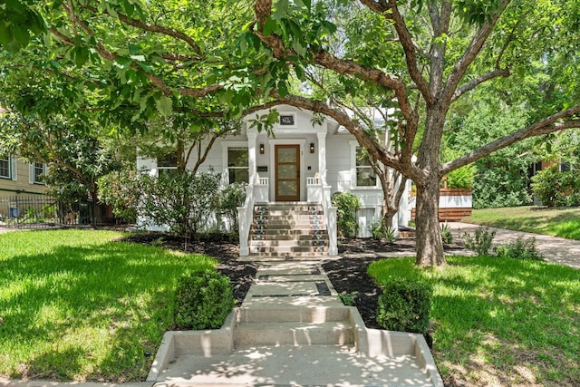 2004 Bremen St, Austin, TX 78703 - obstructed view of property featuring a front yard