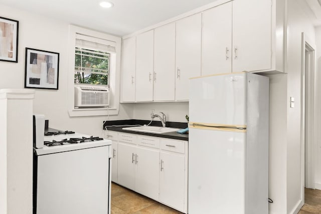 2004 Bremen St, Austin, TX 78703 - kitchen with white appliances, dark countertops, cooling unit, white cabinets, and recessed lighting