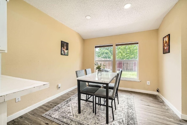7900 Keneshaw Dr, Austin, TX 78745 - dining area with a textured ceiling, wood finished floors, baseboards, and recessed lighting