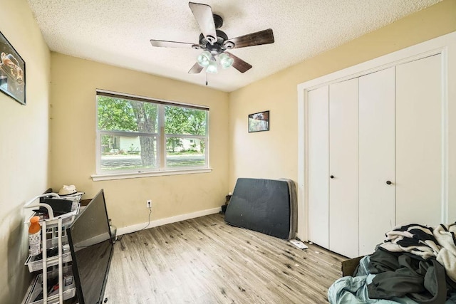 7900 Keneshaw Dr, Austin, TX 78745 - sitting room with ceiling fan, light wood-type flooring, a textured ceiling, and baseboards