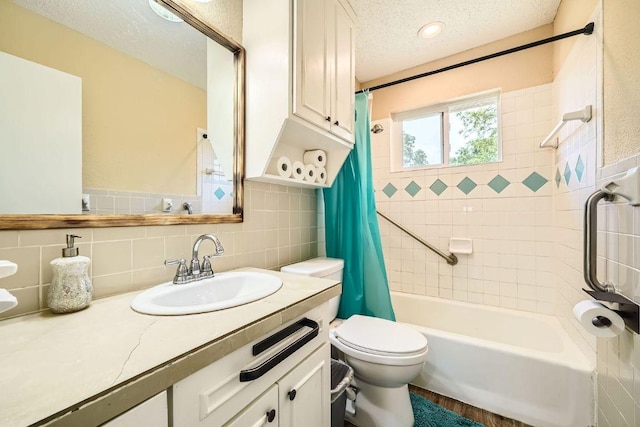 7900 Keneshaw Dr, Austin, TX 78745 - bathroom with a textured ceiling, shower / tub combo with curtain, vanity, and toilet