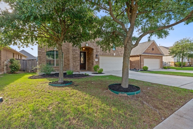 2809 Coral Valley Dr, Leander, TX 78641 - view of front of home with concrete driveway, brick siding, and an attached garage