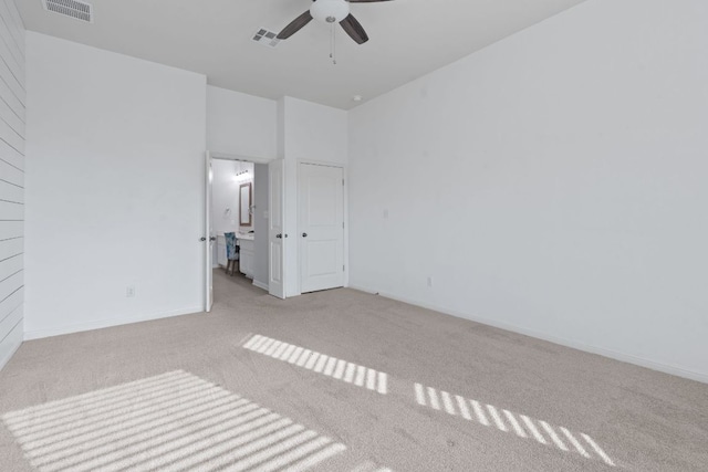 2809 Coral Valley Dr, Leander, TX 78641 - unfurnished bedroom featuring carpet, ensuite bathroom, and ceiling fan