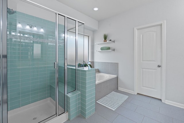2809 Coral Valley Dr, Leander, TX 78641 - bathroom featuring a shower stall, tile patterned flooring, a bath, and baseboards