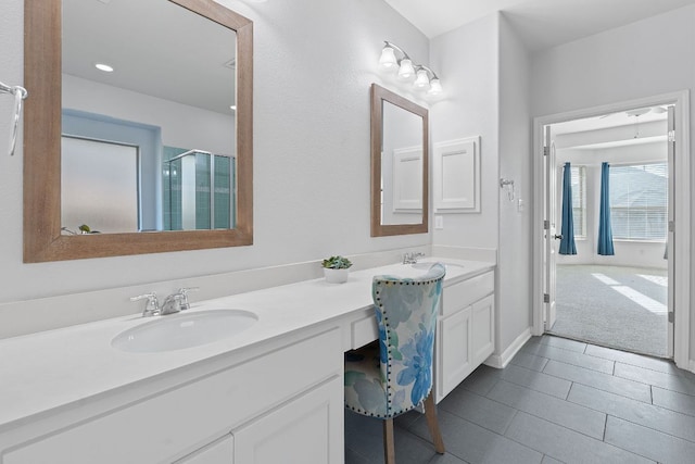 2809 Coral Valley Dr, Leander, TX 78641 - full bathroom with double vanity, an enclosed shower, tile patterned flooring, and recessed lighting