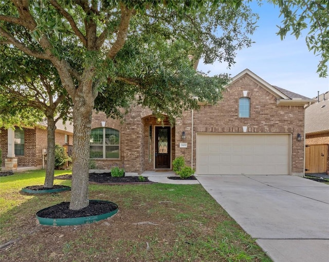 2809 Coral Valley Dr, Leander, TX 78641 - view of front facade featuring concrete driveway and brick siding