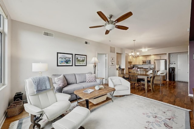 54 Rainey St Unit 814, Austin, TX 78701 - living room with ceiling fan, a chandelier, and dark wood-type flooring
