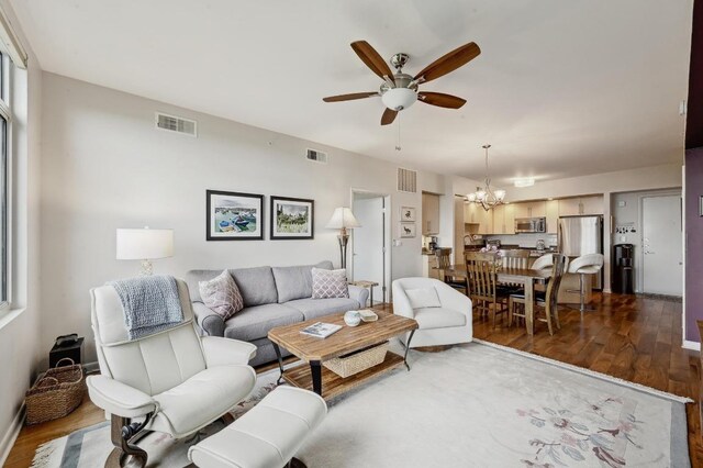 54 Rainey St Unit 814, Austin, TX 78701 - living area with ceiling fan, a chandelier, and dark wood-style flooring