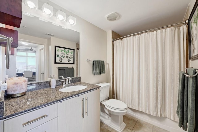 54 Rainey St Unit 814, Austin, TX 78701 - full bathroom with toilet, vanity, tile patterned floors, and a shower with shower curtain