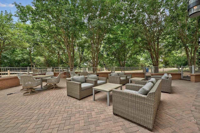 54 Rainey St Unit 814, Austin, TX 78701 - fenced backyard with outdoor lounge area, a patio, and view of wooded area
