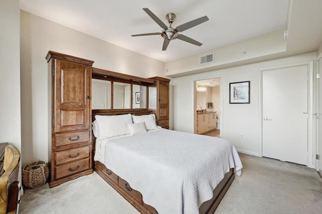 54 Rainey St Unit 814, Austin, TX 78701 - bedroom featuring light carpet, ceiling fan, connected bathroom, and baseboards