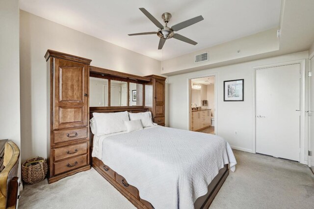 54 Rainey St Unit 814, Austin, TX 78701 - bedroom with light carpet, a ceiling fan, ensuite bathroom, and baseboards