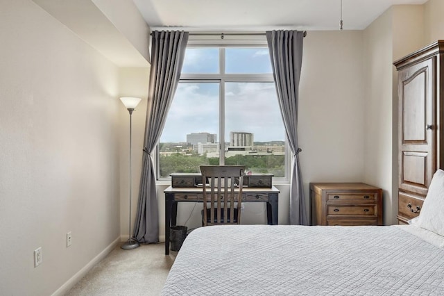 54 Rainey St Unit 814, Austin, TX 78701 - bedroom featuring multiple windows, light carpet, and baseboards