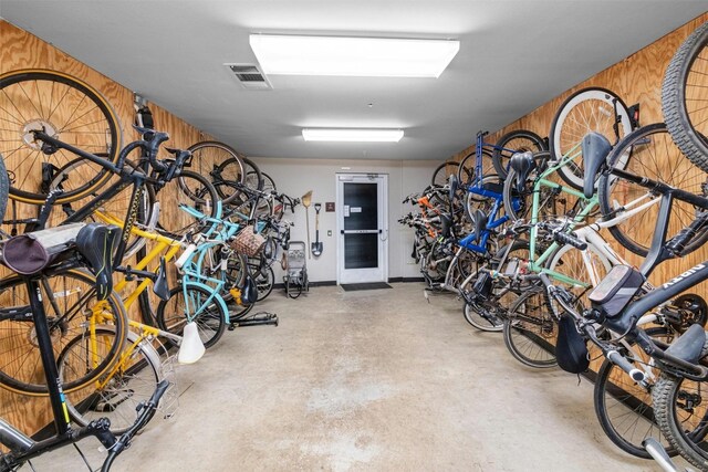 54 Rainey St Unit 814, Austin, TX 78701 - garage featuring wood walls and bike storage
