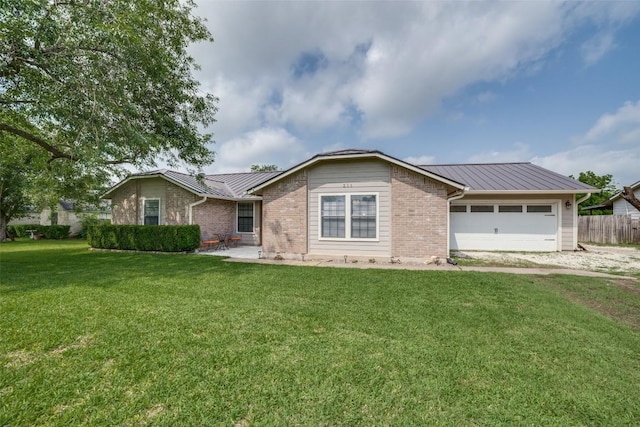 211 Spring Garden Dr, Hutto, TX 78634 - single story home featuring metal roof, a standing seam roof, an attached garage, and brick siding