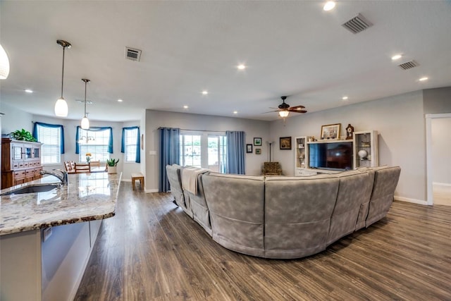 211 Spring Garden Dr, Hutto, TX 78634 - living area with dark wood-style floors, a ceiling fan, baseboards, and recessed lighting