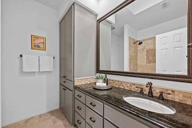 3101 Fleece Flower Cv, Austin, TX 78735 - full bath featuring vanity, a tile shower, and baseboards