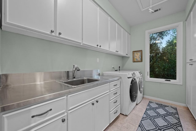 3101 Fleece Flower Cv, Austin, TX 78735 - laundry room with washing machine and clothes dryer, attic access, cabinet space, and baseboards