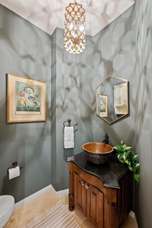 3101 Fleece Flower Cv, Austin, TX 78735 - half bathroom featuring vanity, toilet, and baseboards