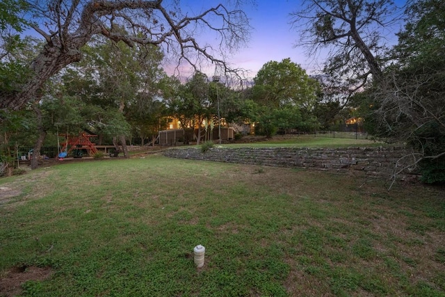 3101 Fleece Flower Cv, Austin, TX 78735 - yard at dusk featuring a playground