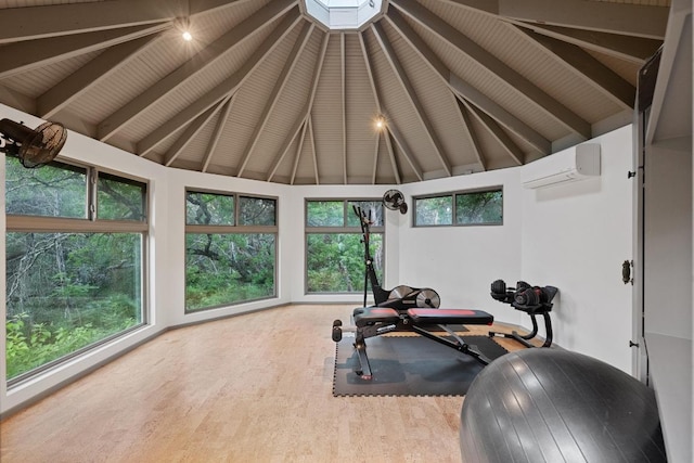 3101 Fleece Flower Cv, Austin, TX 78735 - exercise room featuring an AC wall unit, wood finished floors, and vaulted ceiling