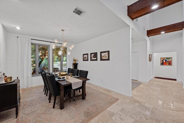3101 Fleece Flower Cv, Austin, TX 78735 - dining area with stone tile floors and a chandelier