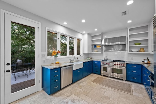 3101 Fleece Flower Cv, Austin, TX 78735 - kitchen with stainless steel appliances, blue cabinets, a sink, open shelves, and decorative backsplash