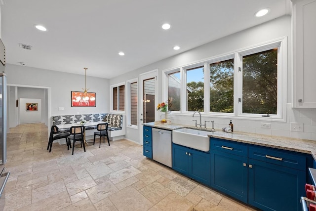 3101 Fleece Flower Cv, Austin, TX 78735 - kitchen with stainless steel dishwasher, a sink, blue cabinets, decorative backsplash, and recessed lighting