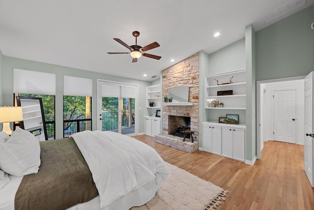 3101 Fleece Flower Cv, Austin, TX 78735 - bedroom featuring vaulted ceiling, access to outside, a stone fireplace, light wood-type flooring, and ceiling fan