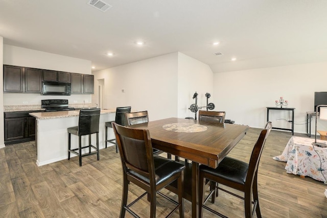 15000 Upland Willow Rd, Austin, TX 78724 - dining room with wood finished floors and recessed lighting