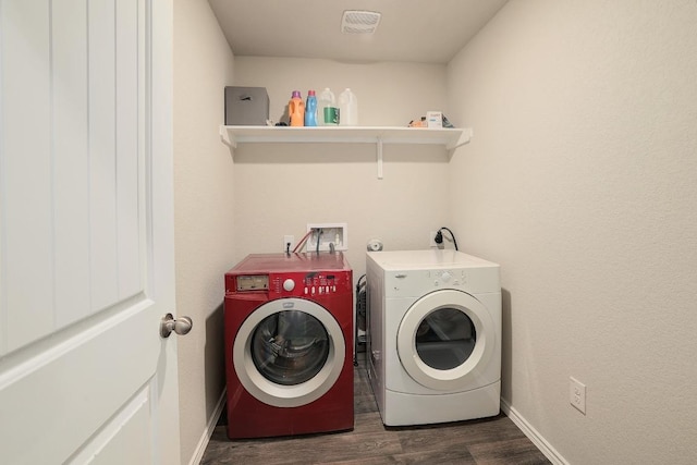 15000 Upland Willow Rd, Austin, TX 78724 - laundry area featuring washing machine and clothes dryer, dark wood finished floors, and baseboards