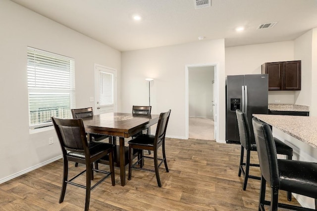 15000 Upland Willow Rd, Austin, TX 78724 - dining room featuring wood finished floors, baseboards, and recessed lighting