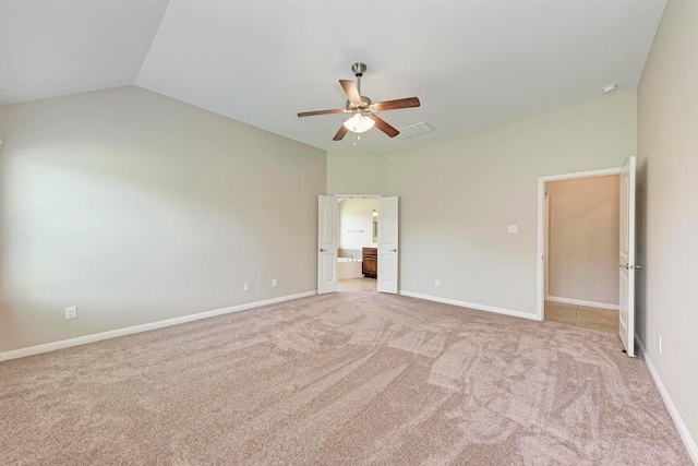 1803 Valle Verde Dr, Cedar Park, TX 78641 - unfurnished bedroom featuring light carpet, ensuite bathroom, lofted ceiling, ceiling fan, and baseboards