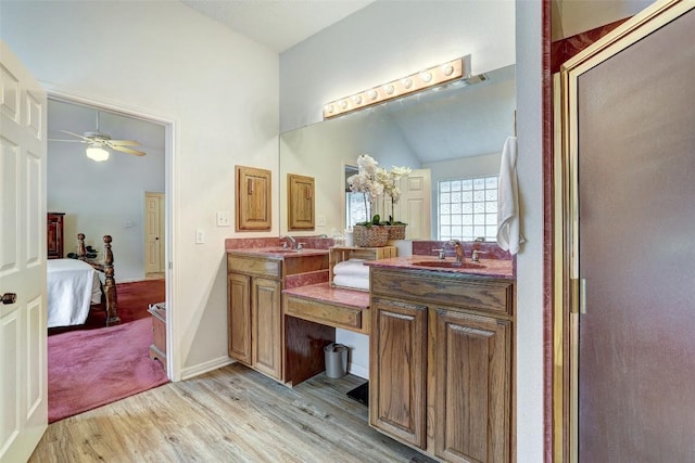 900 Cedar Park Dr, Cedar Park, TX 78613 - bathroom featuring wood finished floors, connected bathroom, vanity, high vaulted ceiling, and a ceiling fan