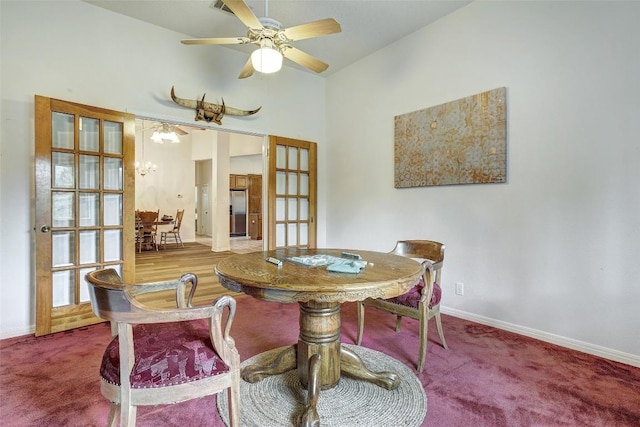 900 Cedar Park Dr, Cedar Park, TX 78613 - carpeted dining area with french doors, baseboards, a chandelier, a ceiling fan, and a towering ceiling