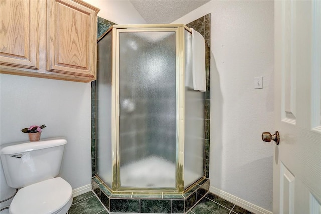 900 Cedar Park Dr, Cedar Park, TX 78613 - full bathroom with a shower stall, toilet, baseboards, and tile patterned floors