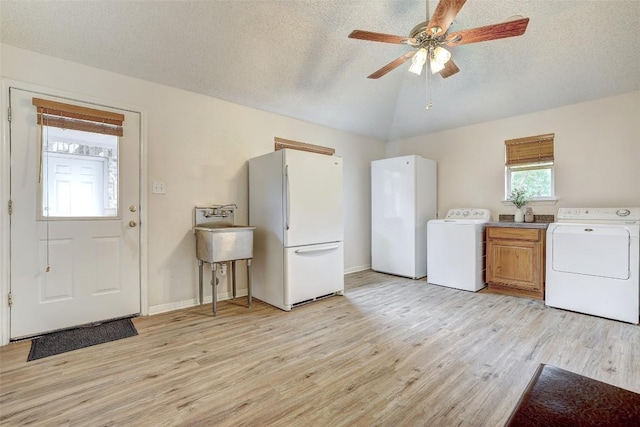 900 Cedar Park Dr, Cedar Park, TX 78613 - washroom with light wood finished floors, cabinet space, ceiling fan, a textured ceiling, and baseboards