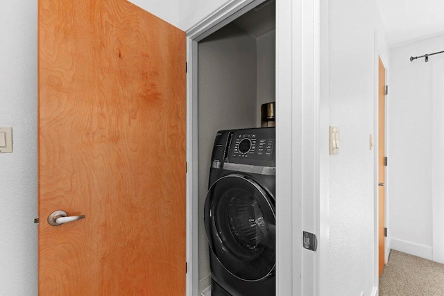 1101 Grove Blvd Unit 803, Austin, TX 78741 - laundry room featuring washer / dryer and carpet floors