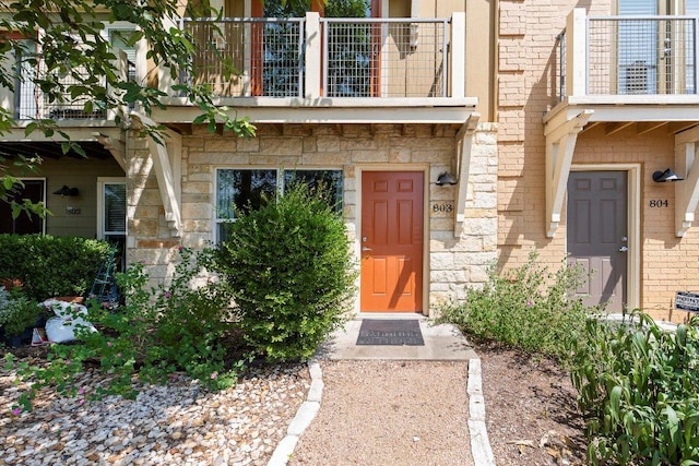 1101 Grove Blvd Unit 803, Austin, TX 78741 - property entrance with a balcony and stone siding