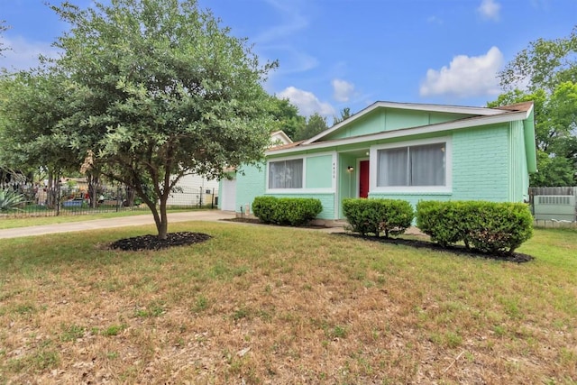 4406 Dove Springs Dr, Austin, TX 78744 - view of front of house with concrete driveway, brick siding, and a garage